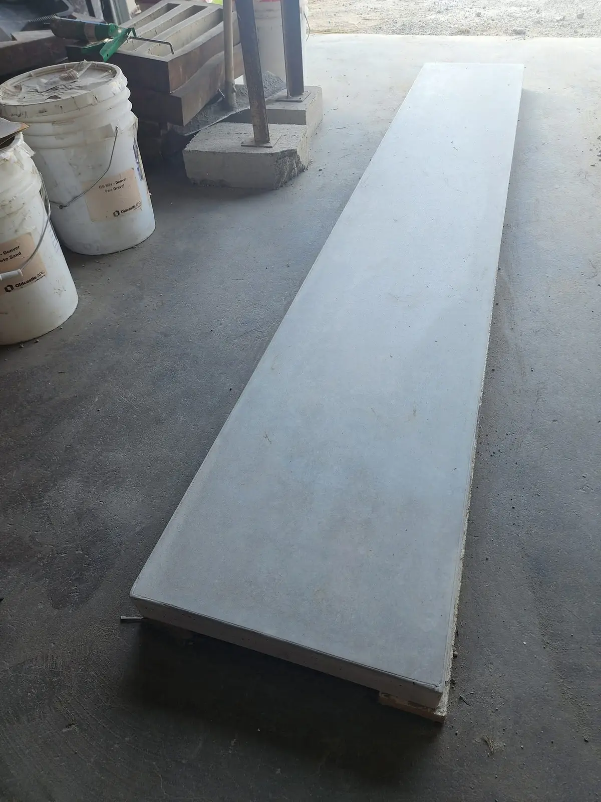 Long custom concrete countertop piece prepared in the shop